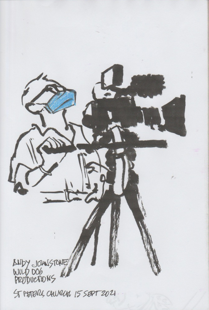 Jeds sketchbook - someone recording the festival